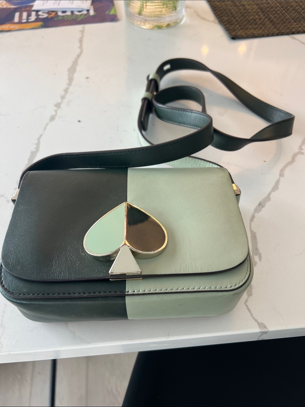 Two-Tone Green Crossbody Bag with Spade Emblem
